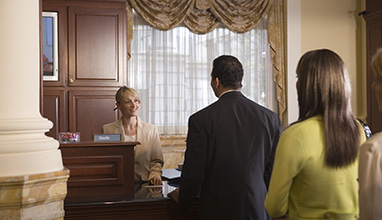 Woman bank teller talking with client