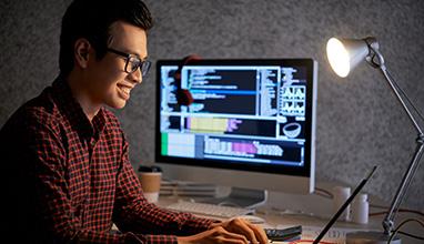 Software engineer working on his laptop