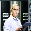 Female technician using a tablet at a server room