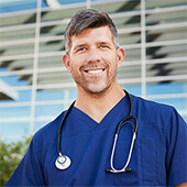 Portrait of a man wearing medical scrubs and a stethoscope around his neck