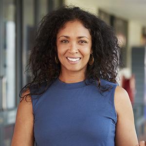 Portrait of a female teacher in a school hallway