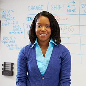 Portrait of a female teacher in front of a whiteboard